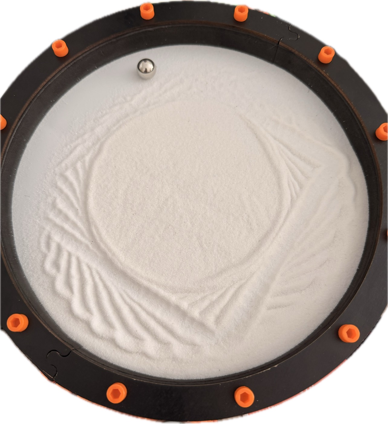 The same tray, but the sand shows a tangle of chords crossing a mostly blank
disc instead of a spiral.
